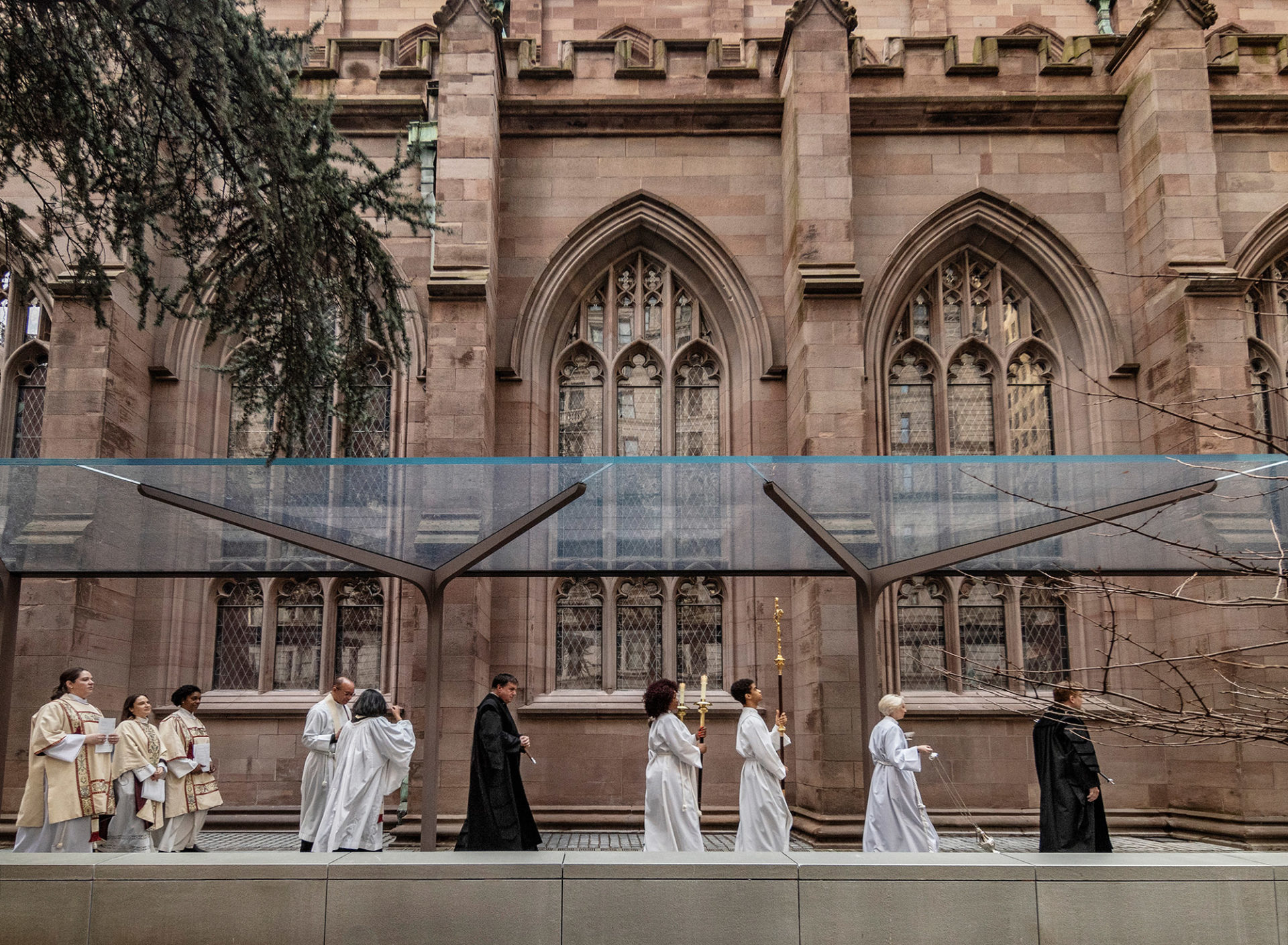 Photo of new cantilevered glass canopy sheltering the new accessible south terrace at Trinity Church Wall Street, designed by MBB Architects.