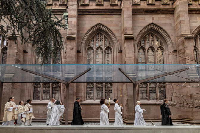 Photo of new cantilevered glass canopy sheltering the new accessible south terrace at Trinity Church Wall Street, designed by MBB Architects.